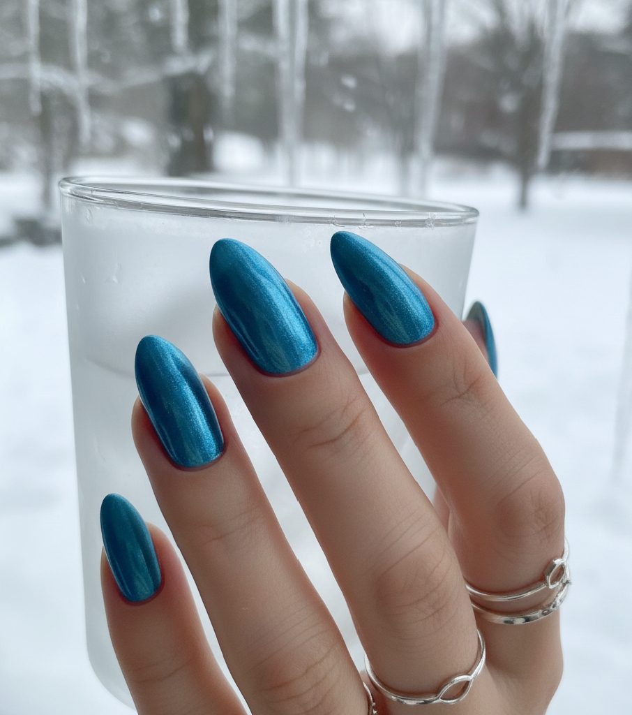 Cool and crisp Glacial Blue chrome nails with an icy metallic finish, perfect for the 2026 winter aesthetic.
